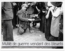 photo d'un homme mutilé de guerre vendant un bleuet de france à la sauvette
